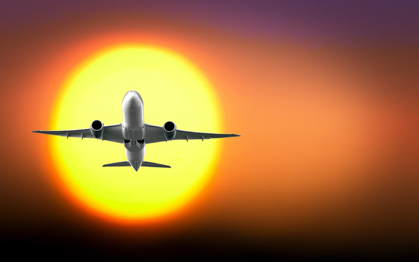 Passenger plane with the sun 00948